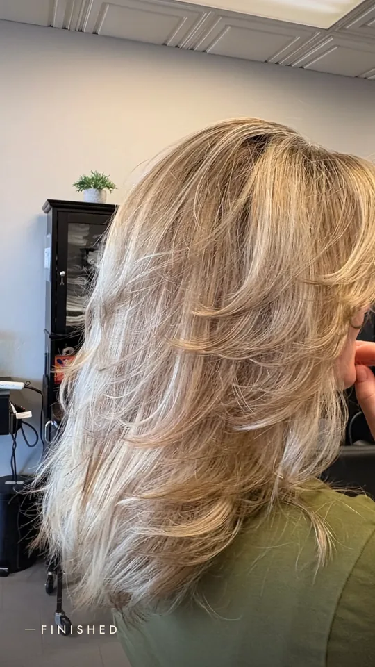 Kyler dimensional blonde portrait after layered cut and K18 treatment